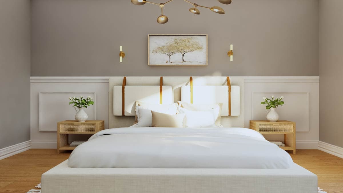 Bedroom with a large upholstered headboard, nightstands with cane fronts, and a modern chandelier.