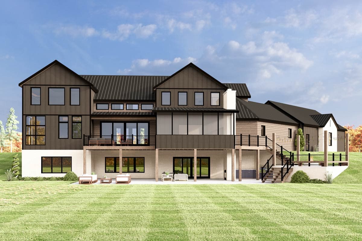 Modern Farmhouse house plan exterior with multiple gables, a metal roof, large windows, and a walk-out basement.