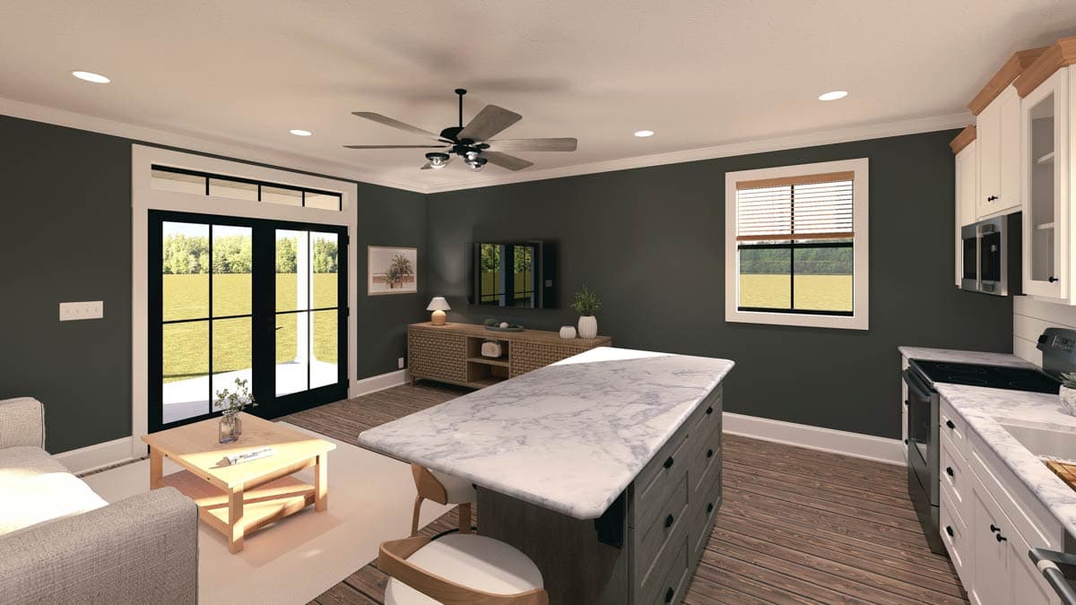 Open concept living area and kitchen with island, fireplace, and double doors to exterior.