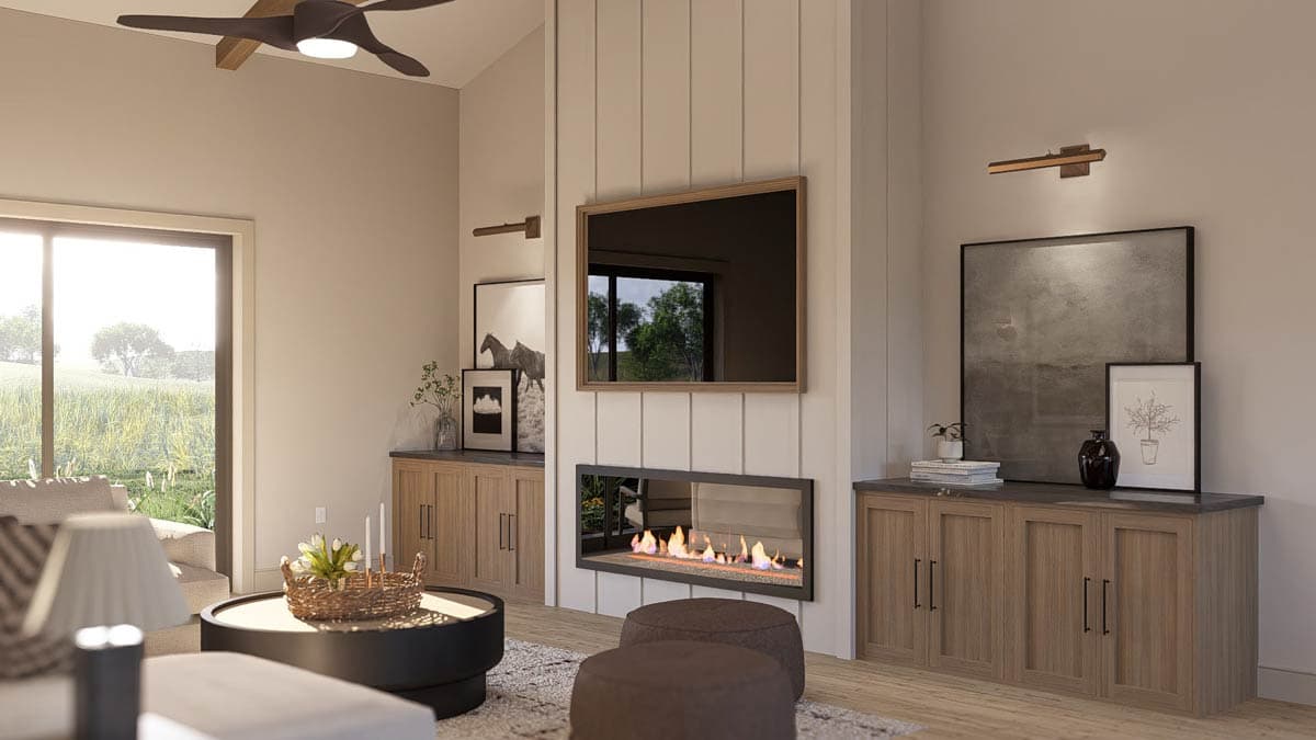 Great room with vaulted ceiling, gas fireplace, wall-mounted TV, and built-in cabinets.