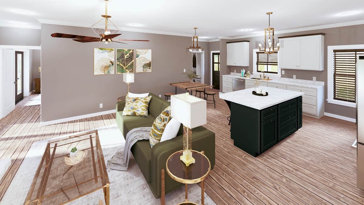 Open-concept living and kitchen area featuring a green sofa, dining table, and dark green island with marble countertop.