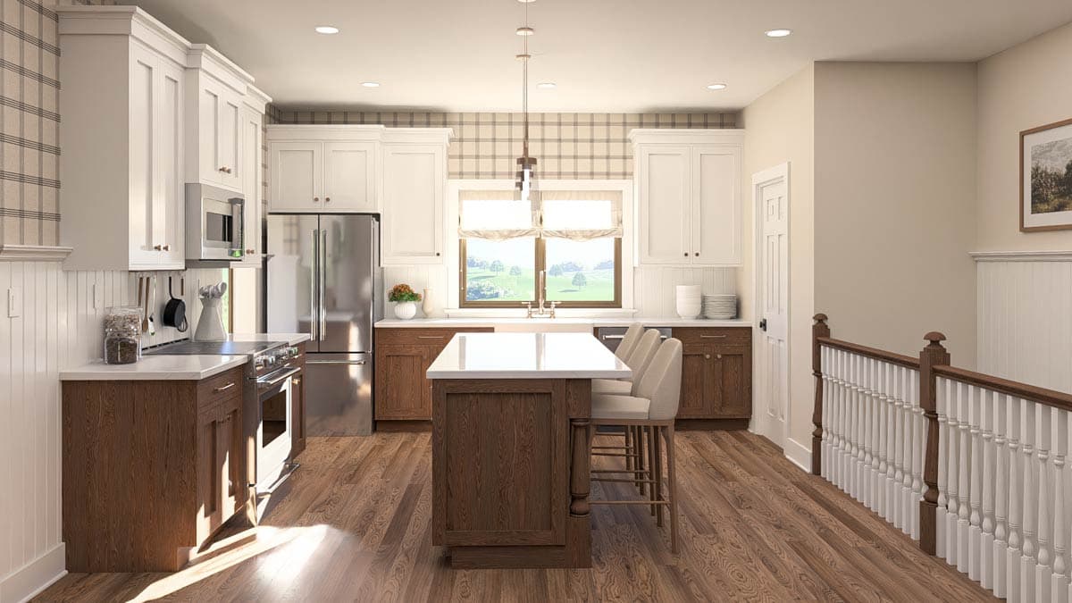 Kitchen with island, white cabinets, stainless steel appliances, and a view of rolling hills through the window.