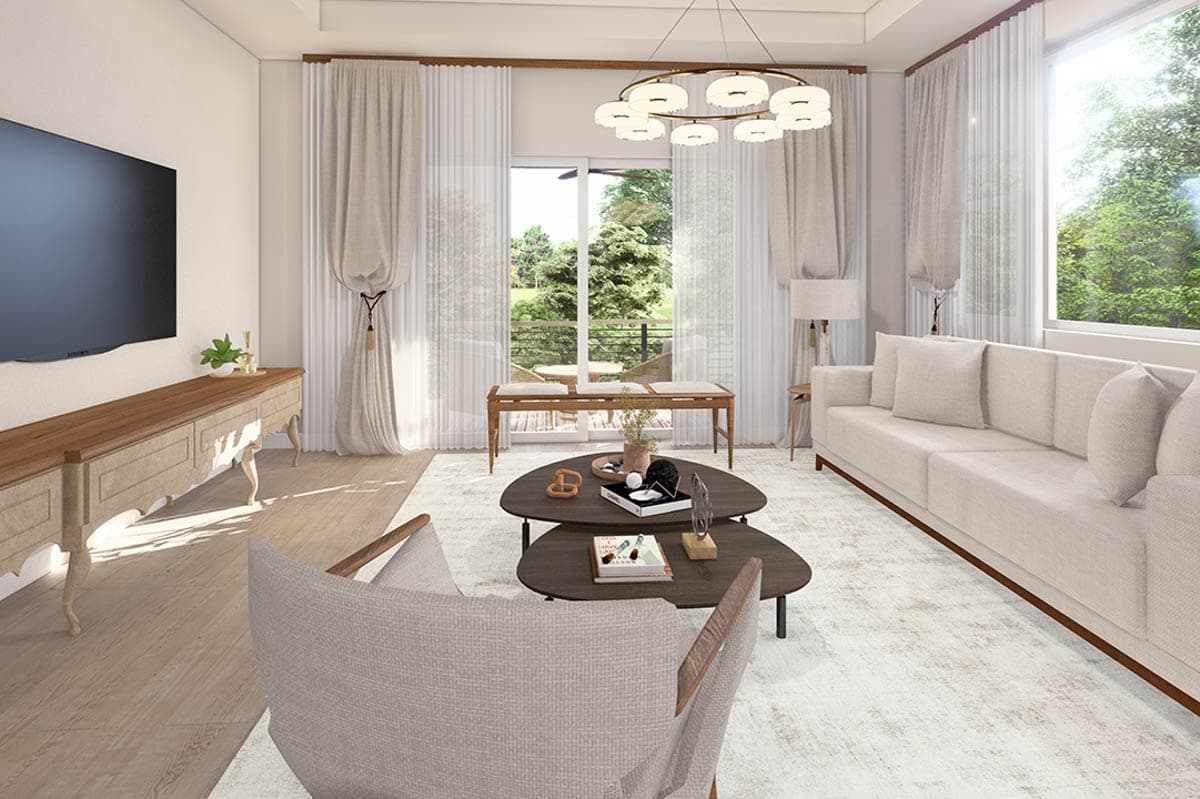 Living room with contemporary sectional sofa, nested coffee tables, entertainment console, and large window overlooking trees.