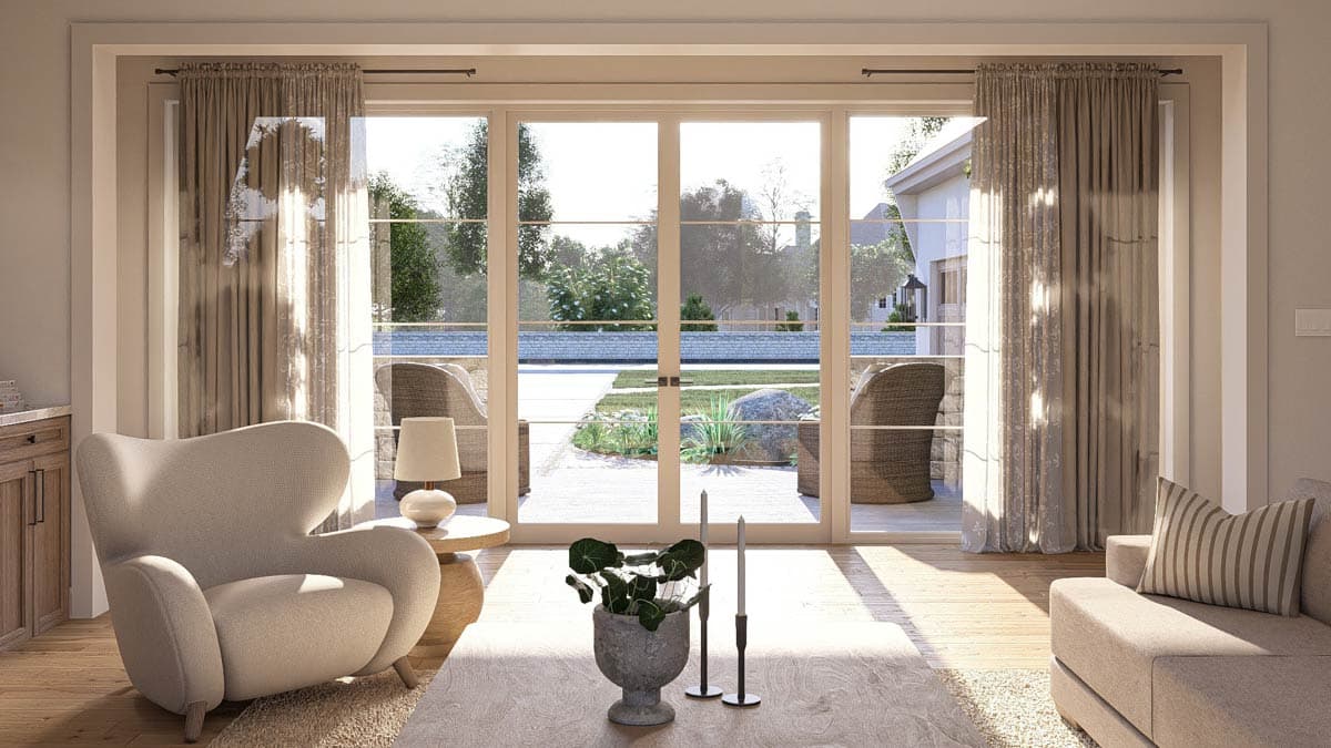 Interior view of a living room with a large sliding glass door opening to a patio and backyard. Features include a fireplace and open layout.