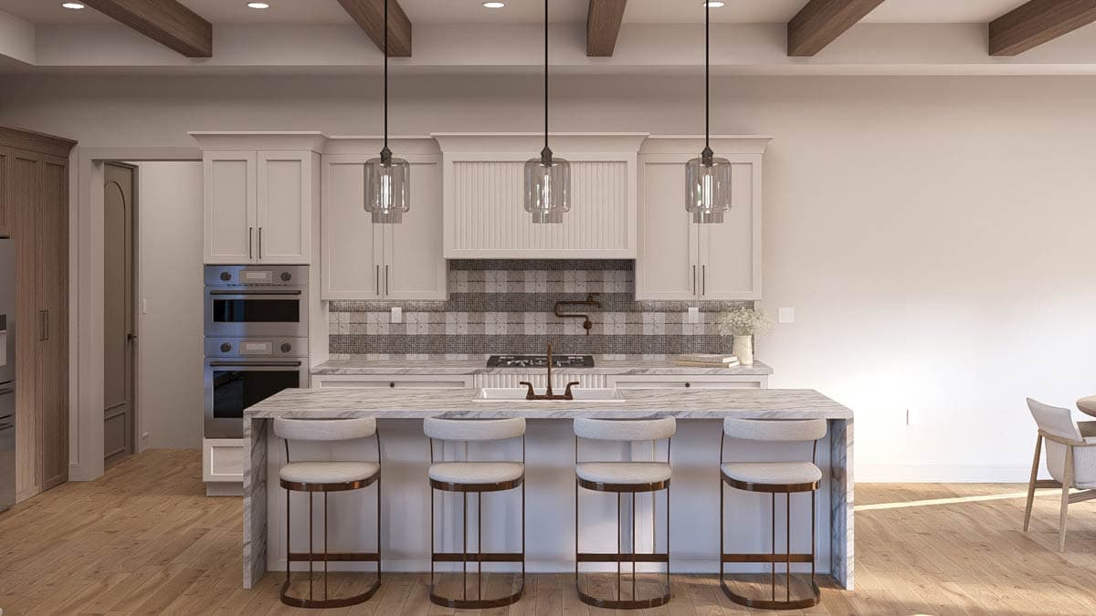 Kitchen with island, white cabinets, stainless steel double oven, and wood beam ceiling.