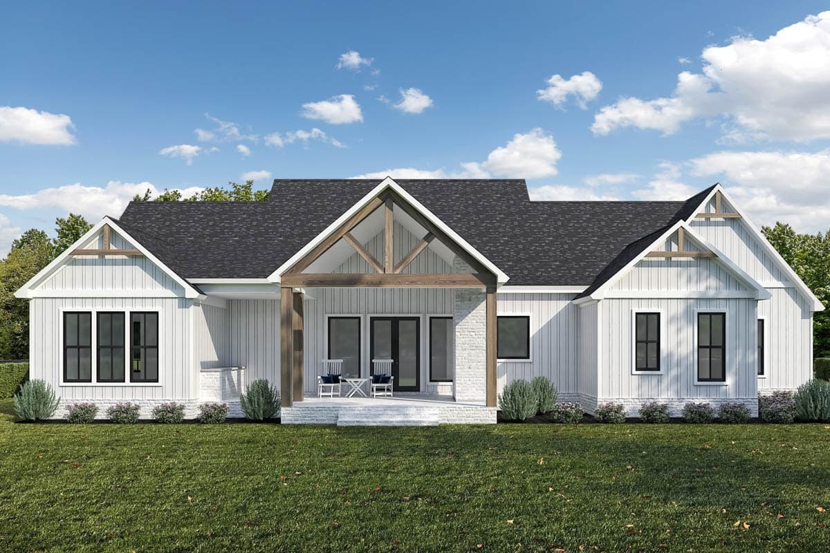 Modern Farmhouse house plan exterior with a gable roof, exposed beams, and a covered porch with stone accents.