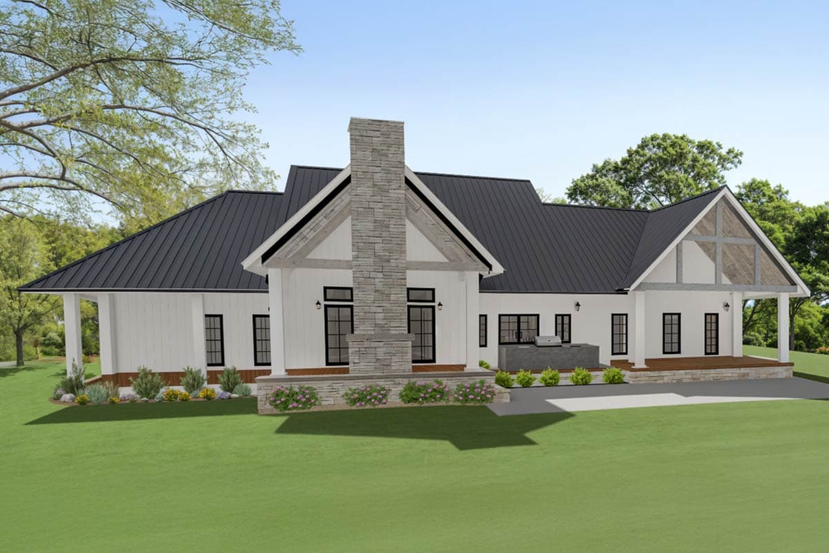 House plan exterior: Modern Farmhouse style, one story, with a prominent stone chimney, gabled rooflines, and a covered outdoor kitchen area.