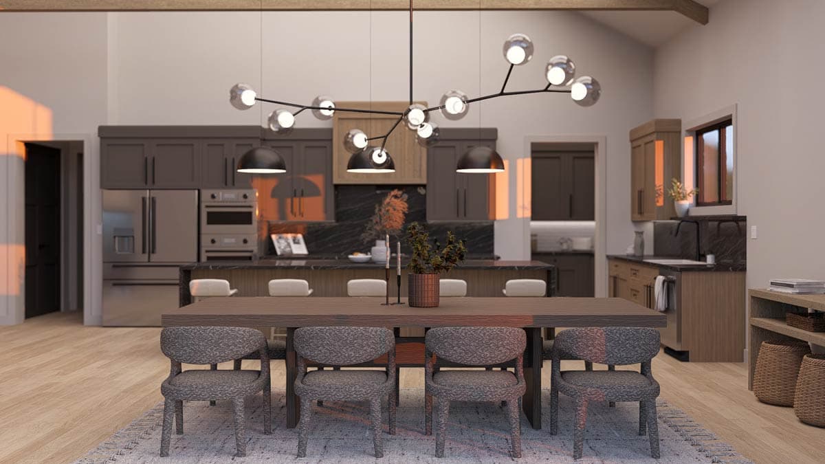 Modern dining area and kitchen with island, pendant lighting, and beamed ceiling.