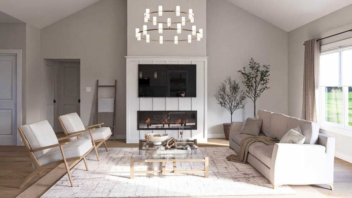 Great room interior with vaulted ceiling, fireplace, modern chandelier, seating area and large window.