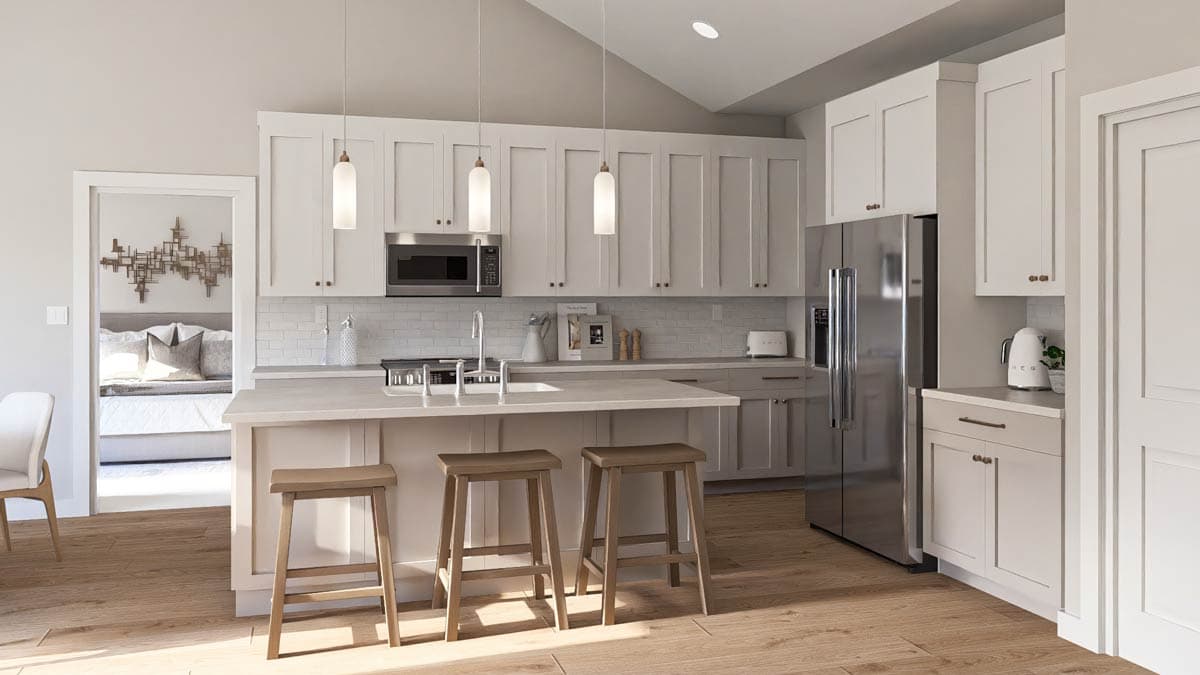 Kitchen with island, pendant lights, white cabinetry, stainless steel appliances, and vaulted ceiling.
