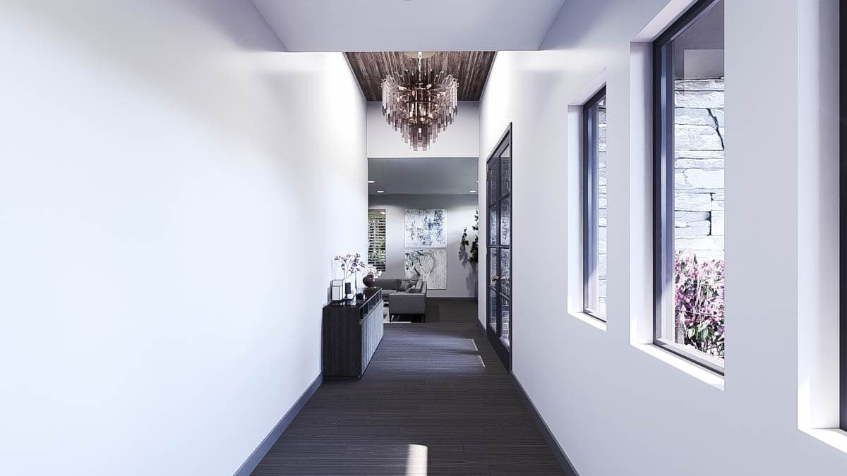 Interior view of a hallway with a coffered wood ceiling, large modern chandelier, floor-to-ceiling windows, and double doors.