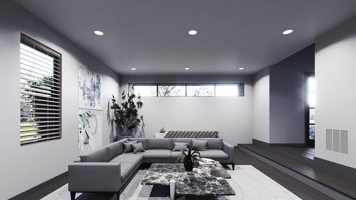 Contemporary living room with sectional sofa, marble-top coffee table, art, and wide horizontal windows.