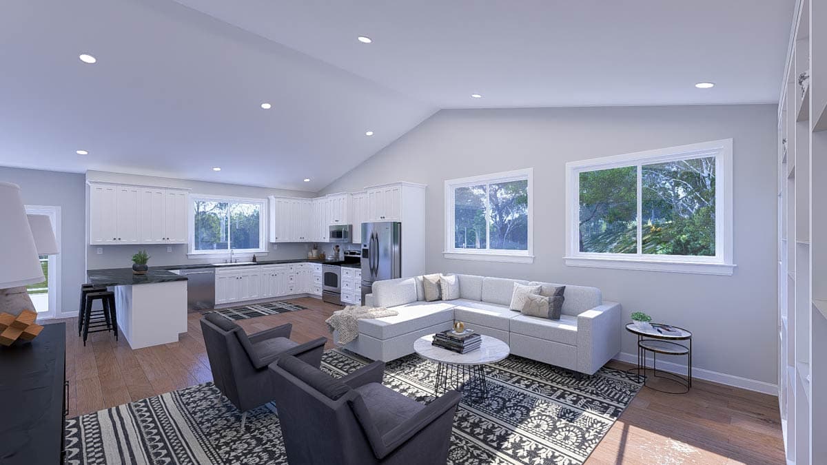 Interior rendering of an open-concept living and kitchen area with vaulted ceiling, white cabinetry, sectional sofa, and large windows.