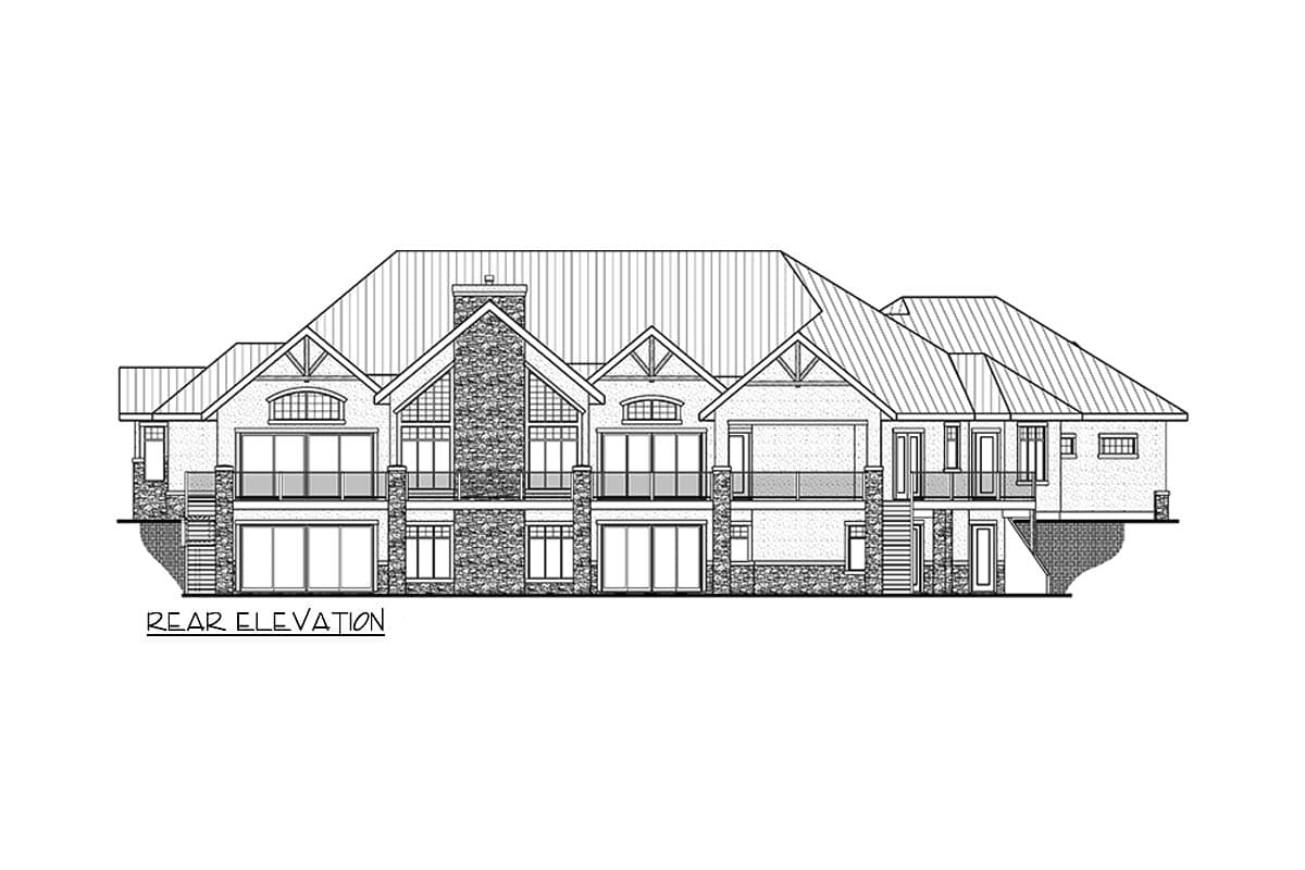 Rear elevation of a multi-level house plan featuring gables, a stone chimney, and multiple balconies with glass railings.