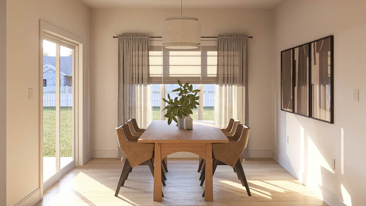 Dining room with wooden table, chairs, large windows, pendant light, and sliding glass door to backyard.