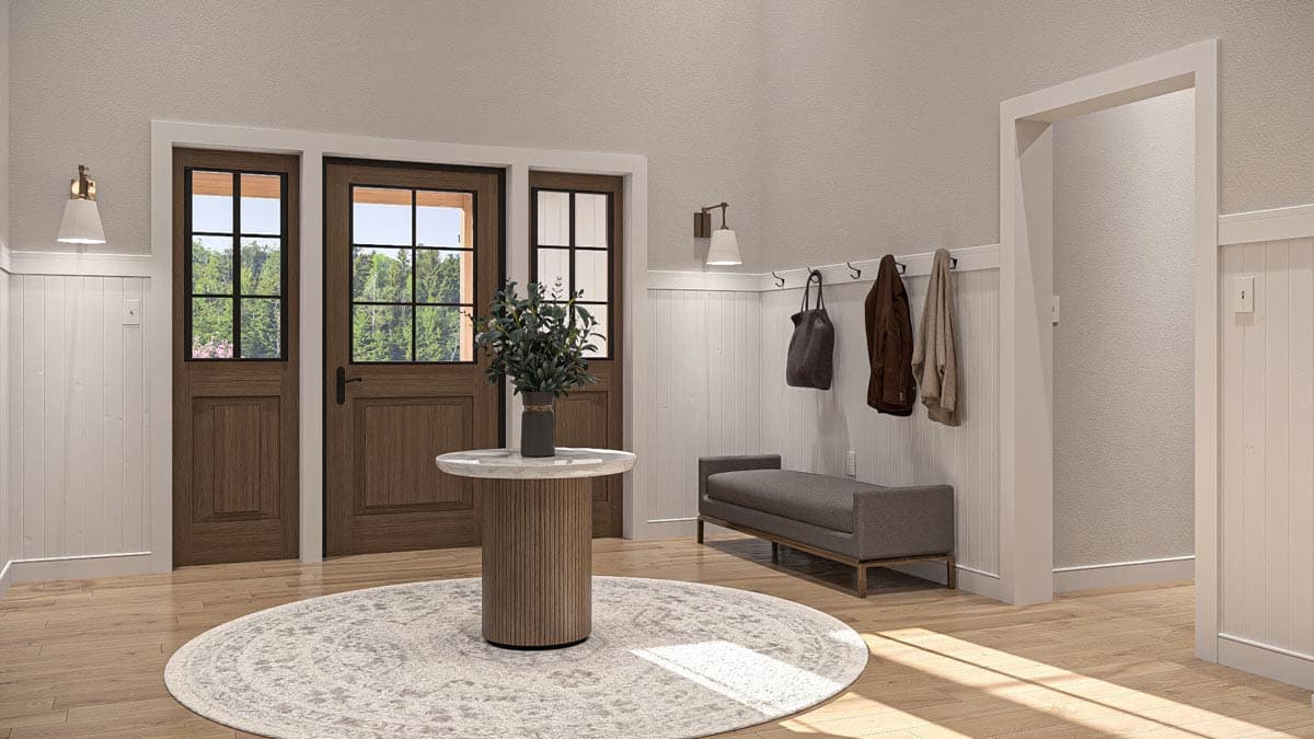 Interior entryway with double doors, wainscoting, bench, and round rug.