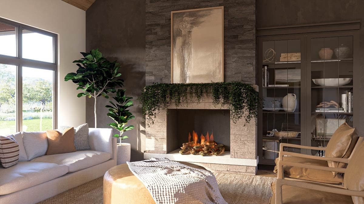 Living room with stone fireplace, vaulted ceiling, large windows, built-in cabinetry, and sectional sofa.