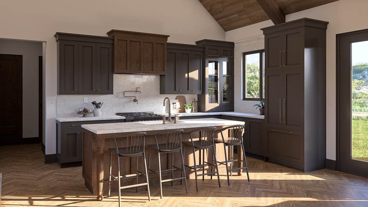 Kitchen interior with dark cabinets, island with seating, gas range, pot filler, and vaulted wood-beam ceiling.