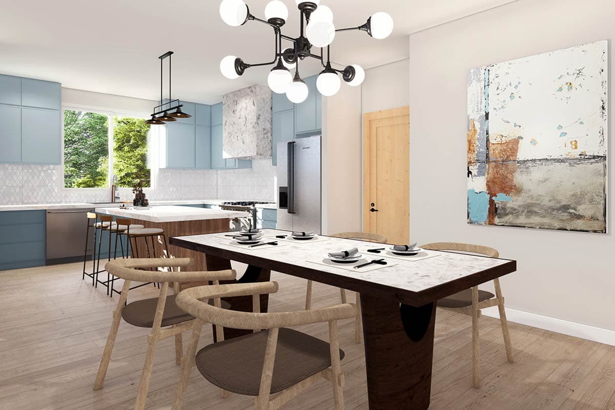 Open concept dining and kitchen area with a large island, light wood floors, and light blue cabinets.
