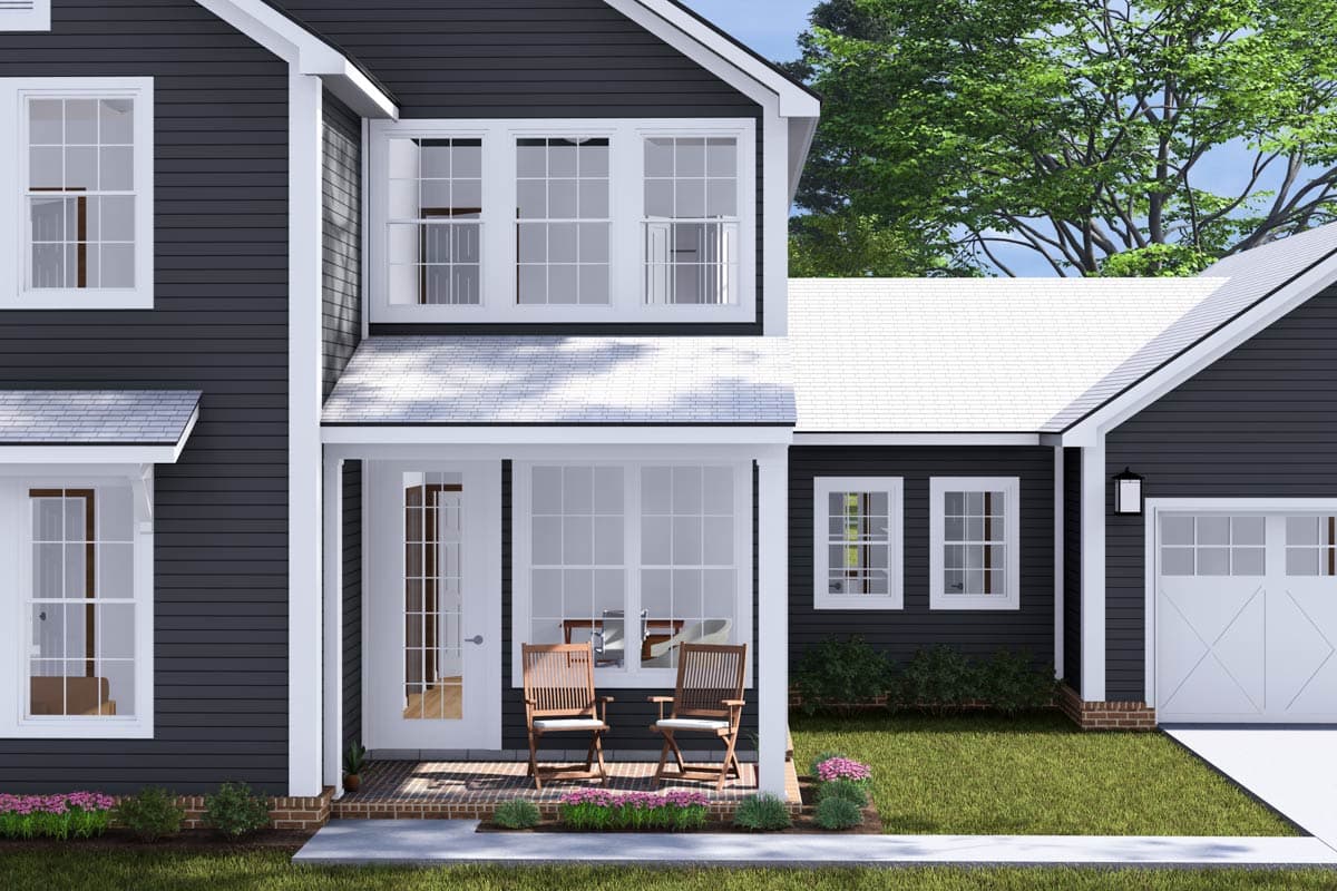 House plan exterior, two stories, dark siding, white trim, gabled dormers, covered entry porch, attached garage.