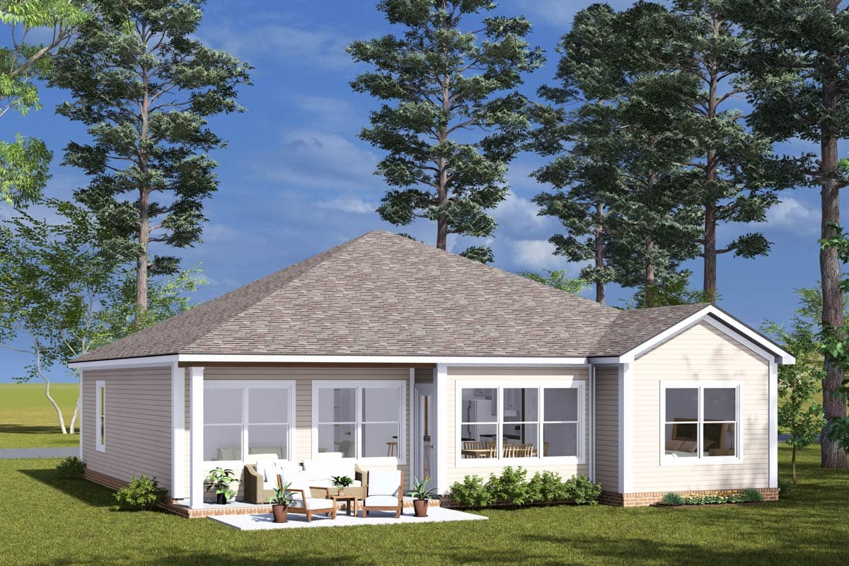 Ranch-style house plan exterior with a hipped roof, covered patio with furniture, and numerous windows.