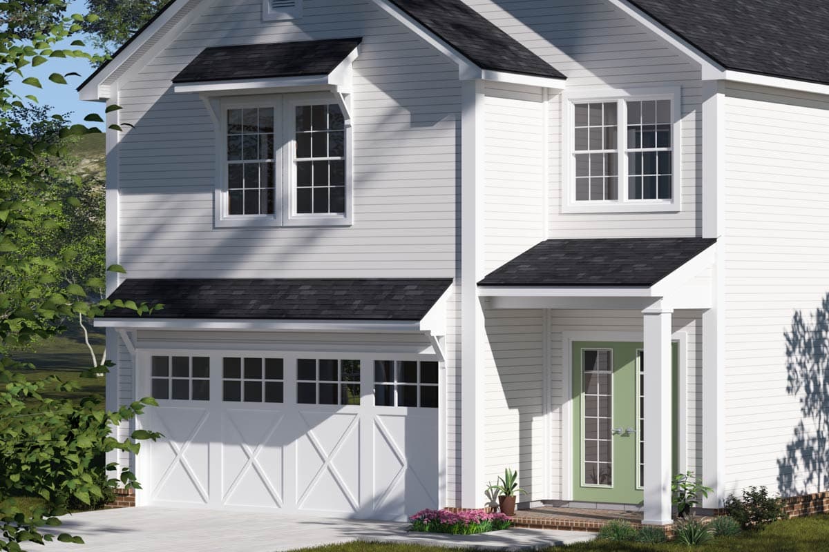 House plan exterior: Two-story white siding home with a two-car garage, gabled dormer windows, and a covered front entry.