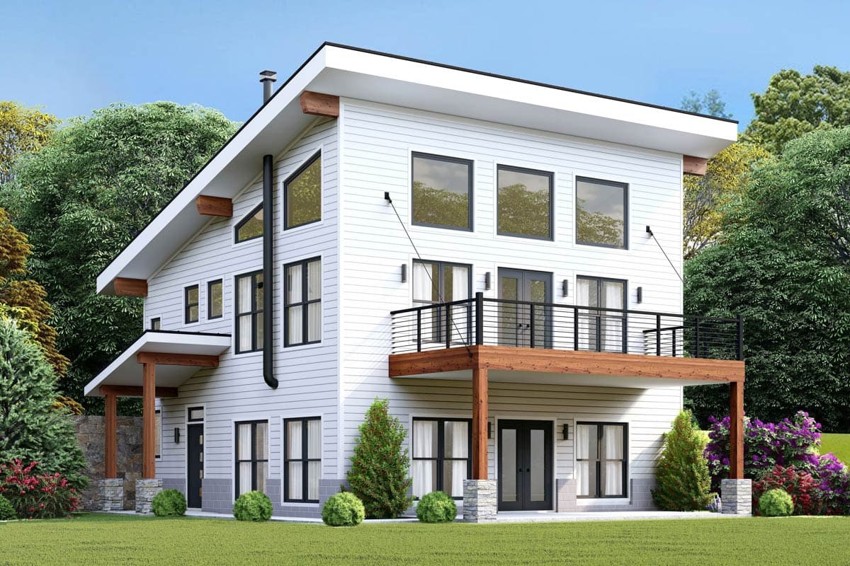 House plan exterior. Two-story modern house with a shed roof, a balcony, large windows, and an angled roofline.