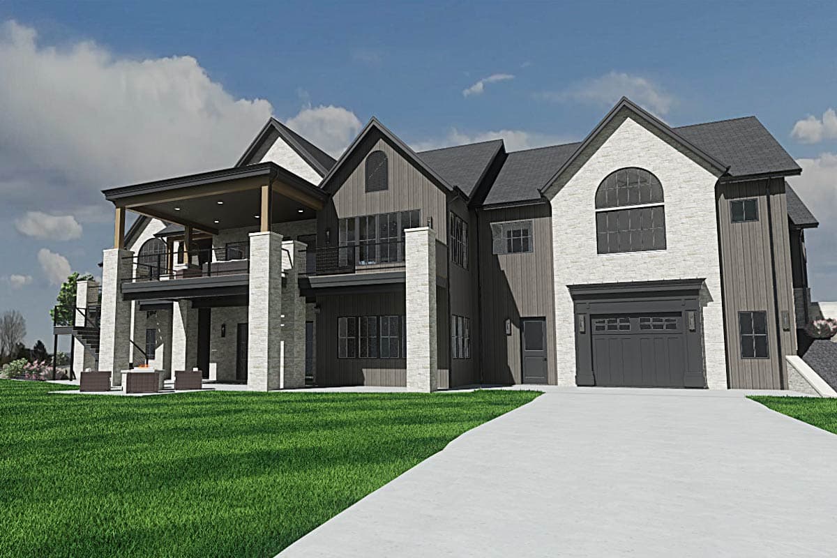 A modern, multi-story home with a light-colored brick exterior, dark grey siding, and a covered porch. A paved driveway leads to a garage.