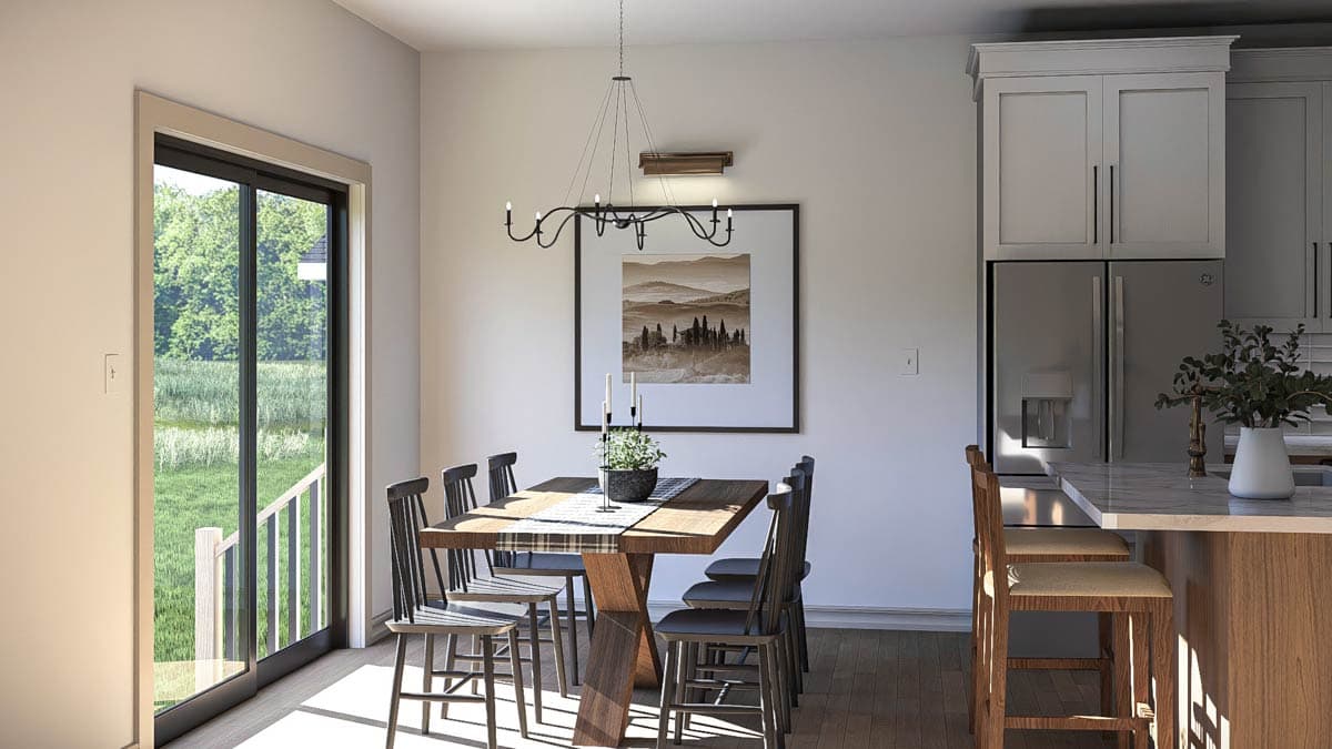 Dining area with a table for six, contemporary chandelier, and sliding glass door to an exterior view. Kitchen island with bar stools visible.