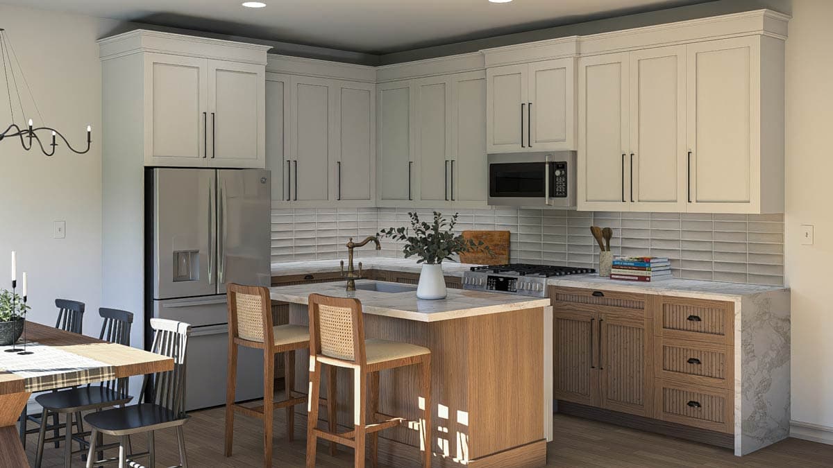 Kitchen with shaker cabinets, island with seating, stainless steel refrigerator, gas range, and subway tile backsplash.