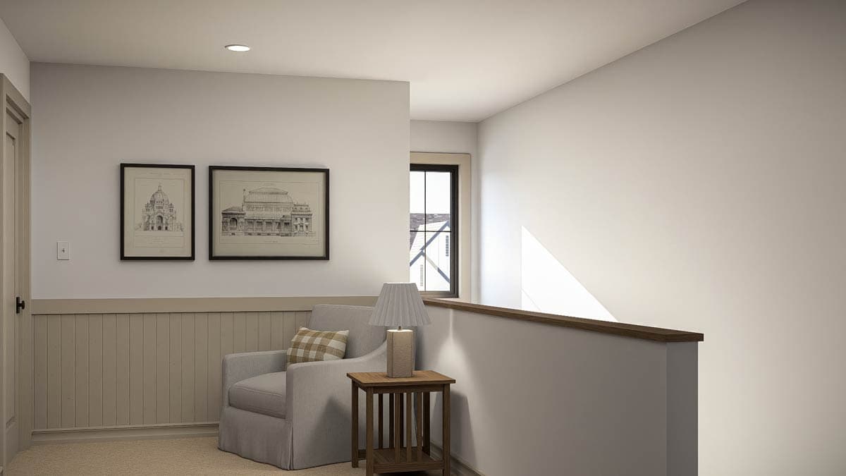 Interior view of a landing with a chair, side table, lamp, and architectural prints on the wall.
