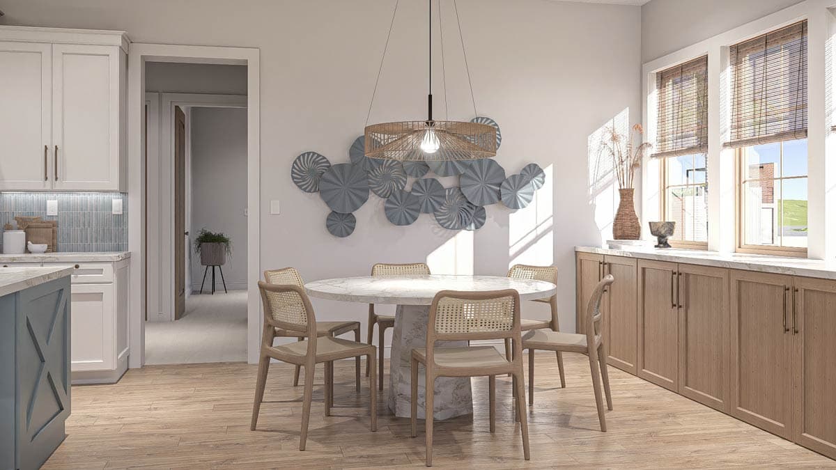 Dining area with marble-top table, cane-back chairs, and built-in wood cabinetry, adjacent to kitchen.