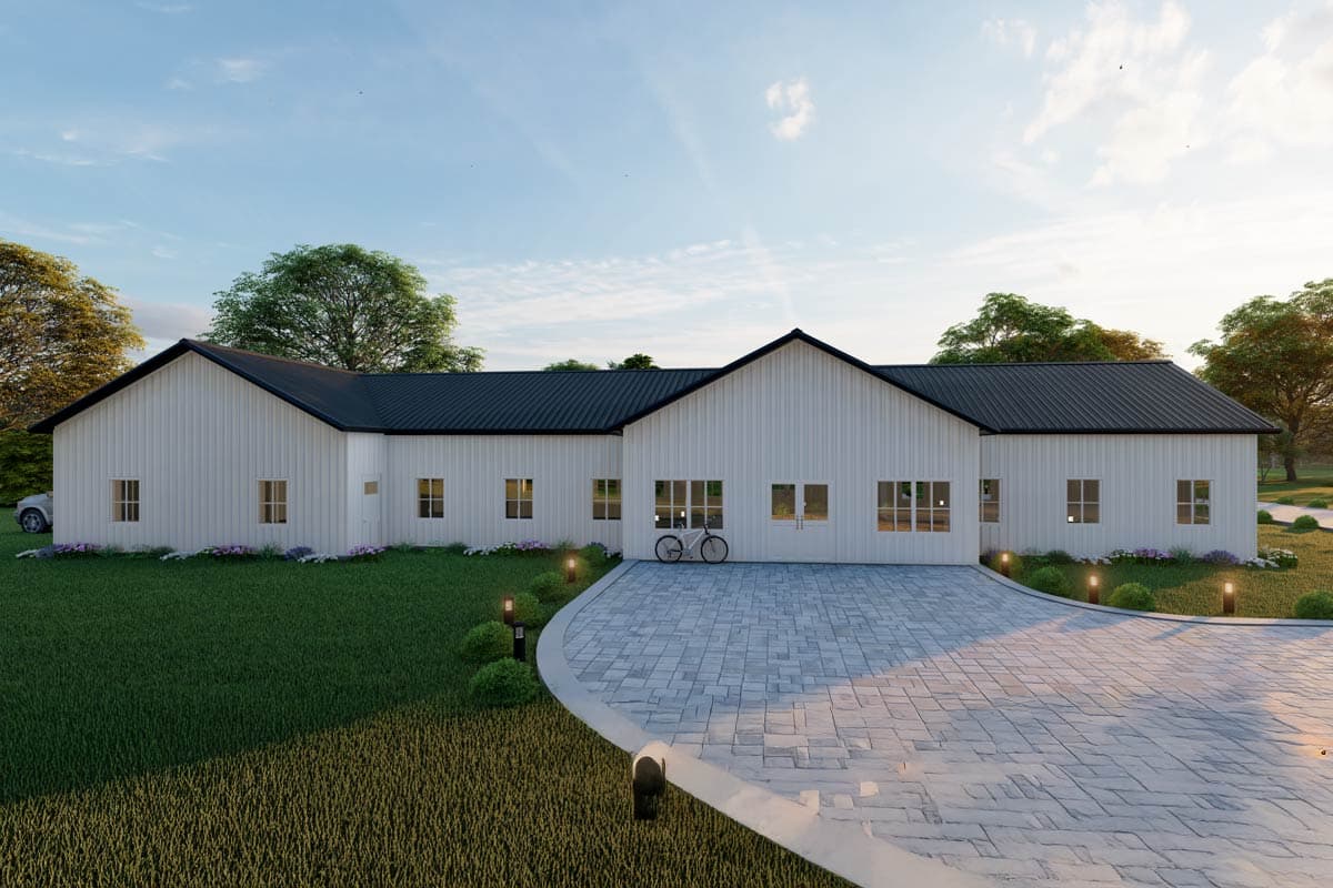 House plan exterior with white siding, black metal roof, and gabled rooflines. Includes a paved driveway and landscape lighting.