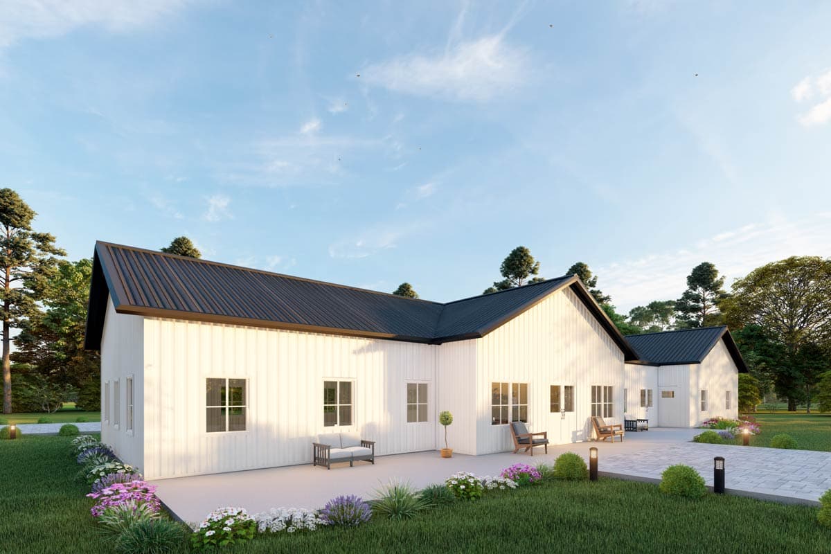Modern Farmhouse house plan exterior, one story, white vertical siding, black metal roof, multiple gables, and patio.