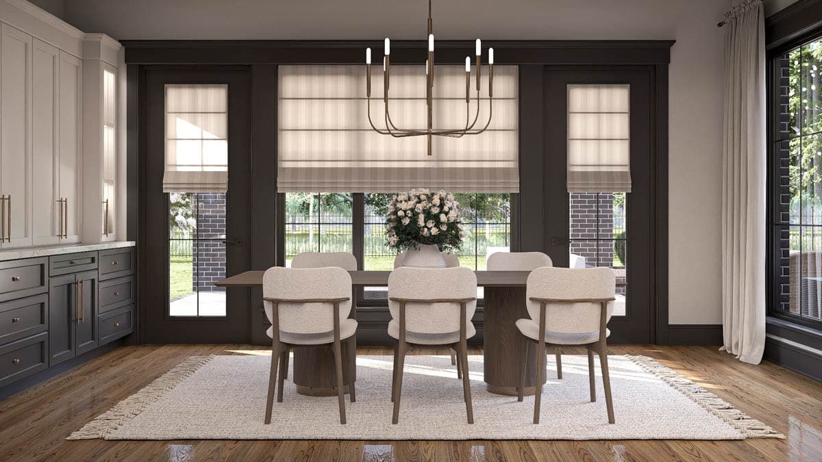 Dining room with dark trim, modern chandelier, white chairs, large windows, and dark gray kitchen cabinets.