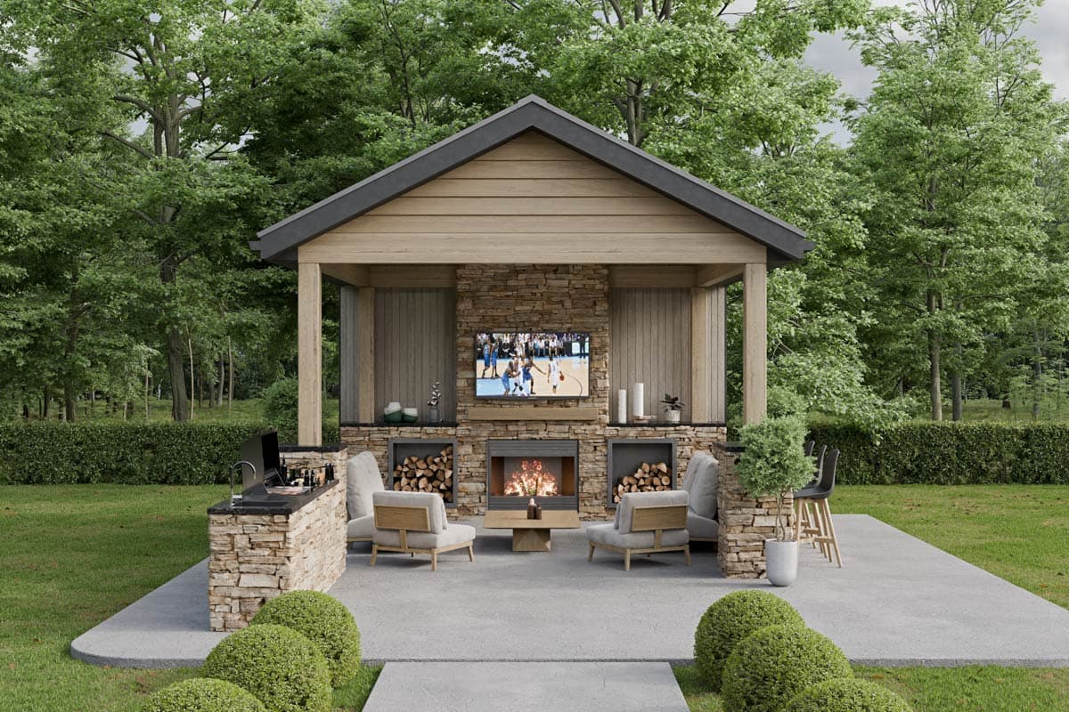 House plan exterior. Open-air structure with stone fireplace, TV, and wood storage. Features include gabled roof and stone facade.