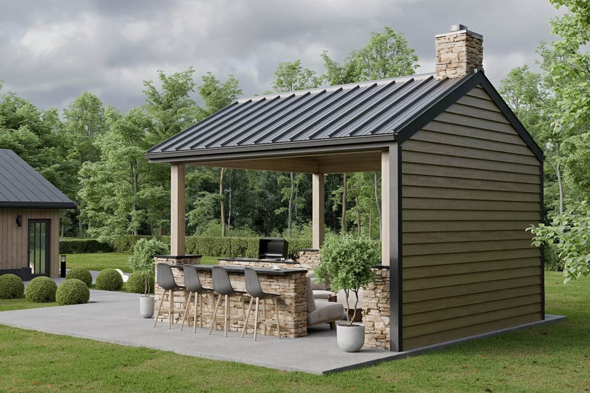 Outdoor living space with covered kitchen, stone base bar, metal roof, and wood siding.
