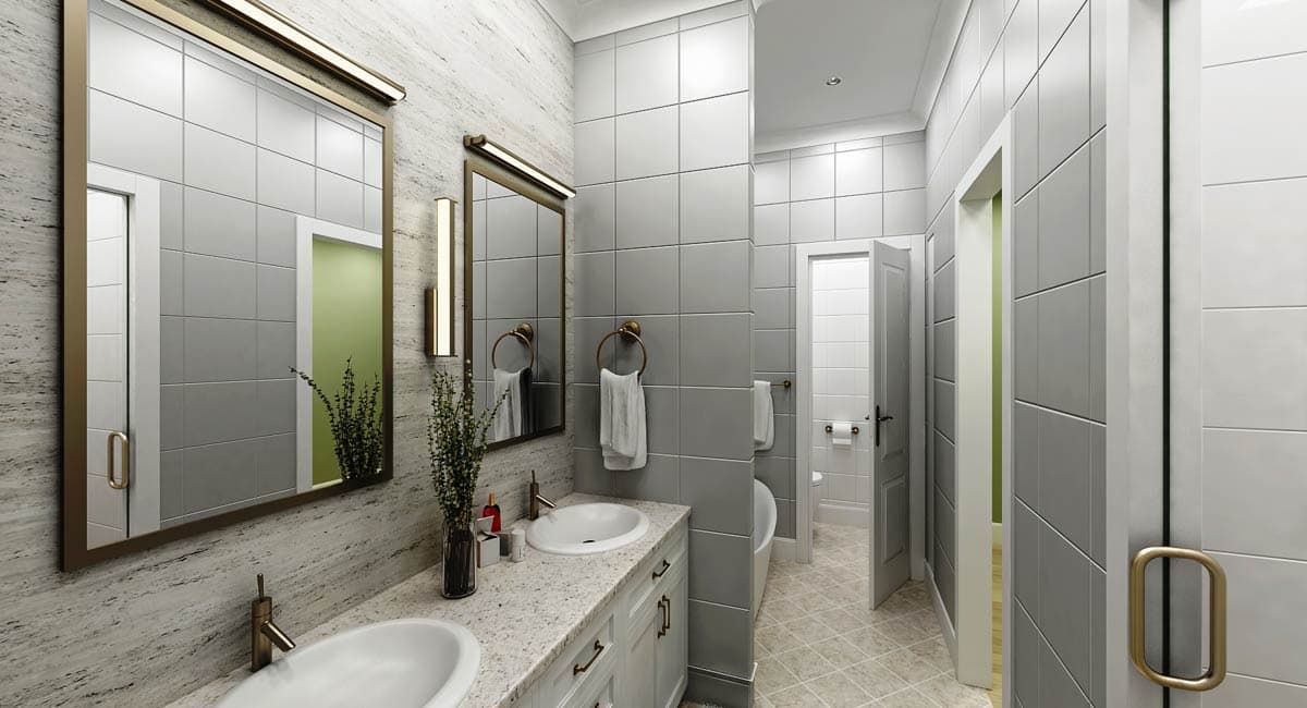 Bathroom with double vanity, grey tile walls, and doors to toilet and shower areas.