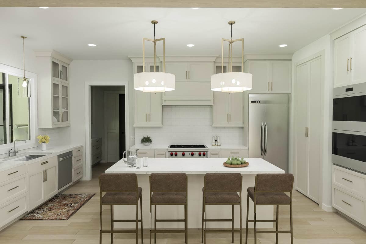 Modern kitchen with island, white cabinets, stainless steel appliances, subway tile backsplash, and pendant lighting.