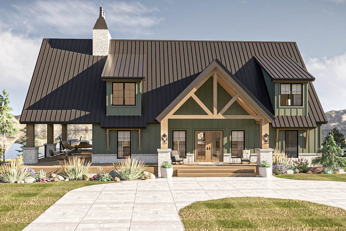 House plan exterior. Two-story, green-sided home with a metal roof, dormers, and a covered porch. Features exposed timber framing and stone accents.