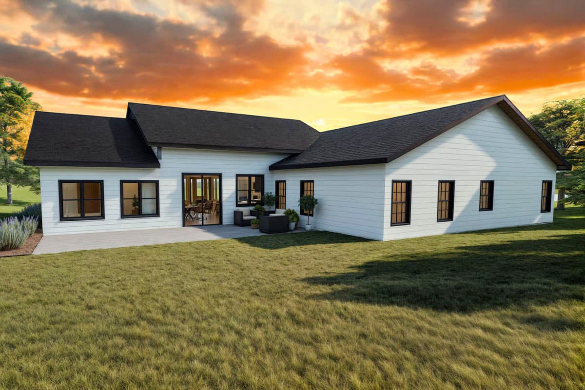 Modern Farmhouse house plan exterior with white horizontal siding, large windows, gable roof, and a patio.