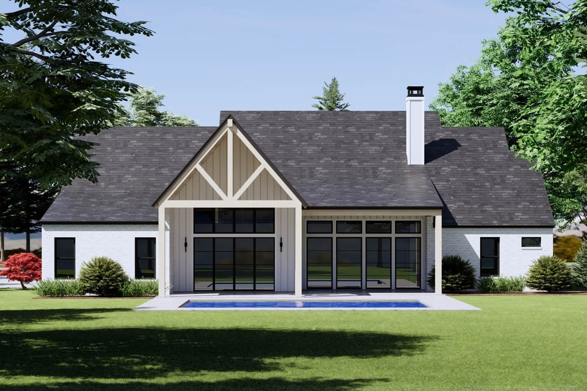 Modern Farmhouse house plan exterior with white brick, gable with exposed beams, large windows, and covered patio.