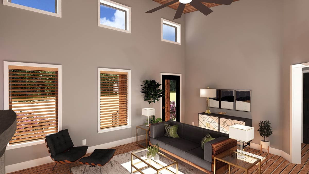 Interior rendering of a great room with vaulted ceiling, wood fan, and large windows. Features sofa, coffee table, and sideboard.