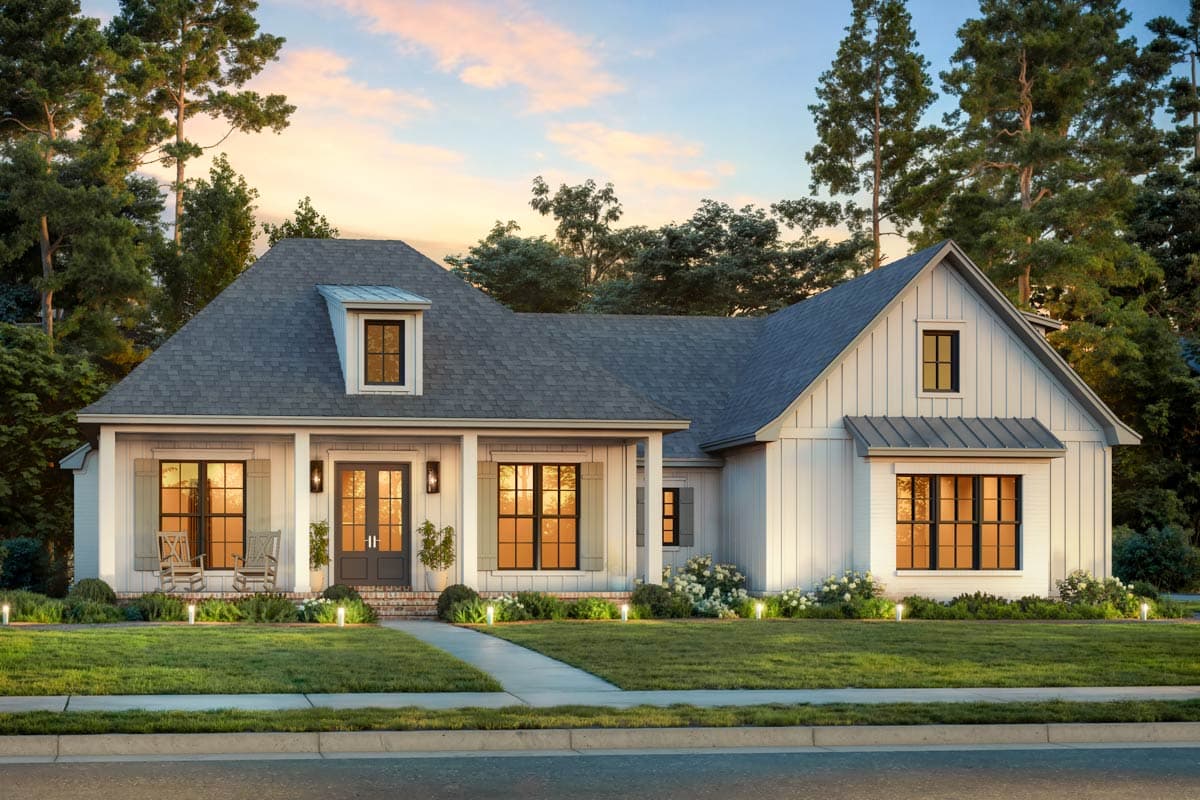 House plan exterior featuring a farmhouse style with a front porch, gables, and dormer windows. One-story home with a gray shingled roof.