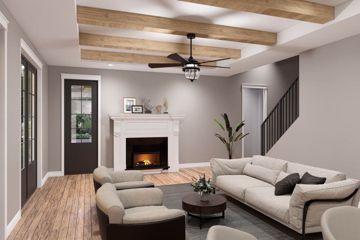 Living room with wood-beamed ceiling, fireplace, glass-paneled door, and staircase.