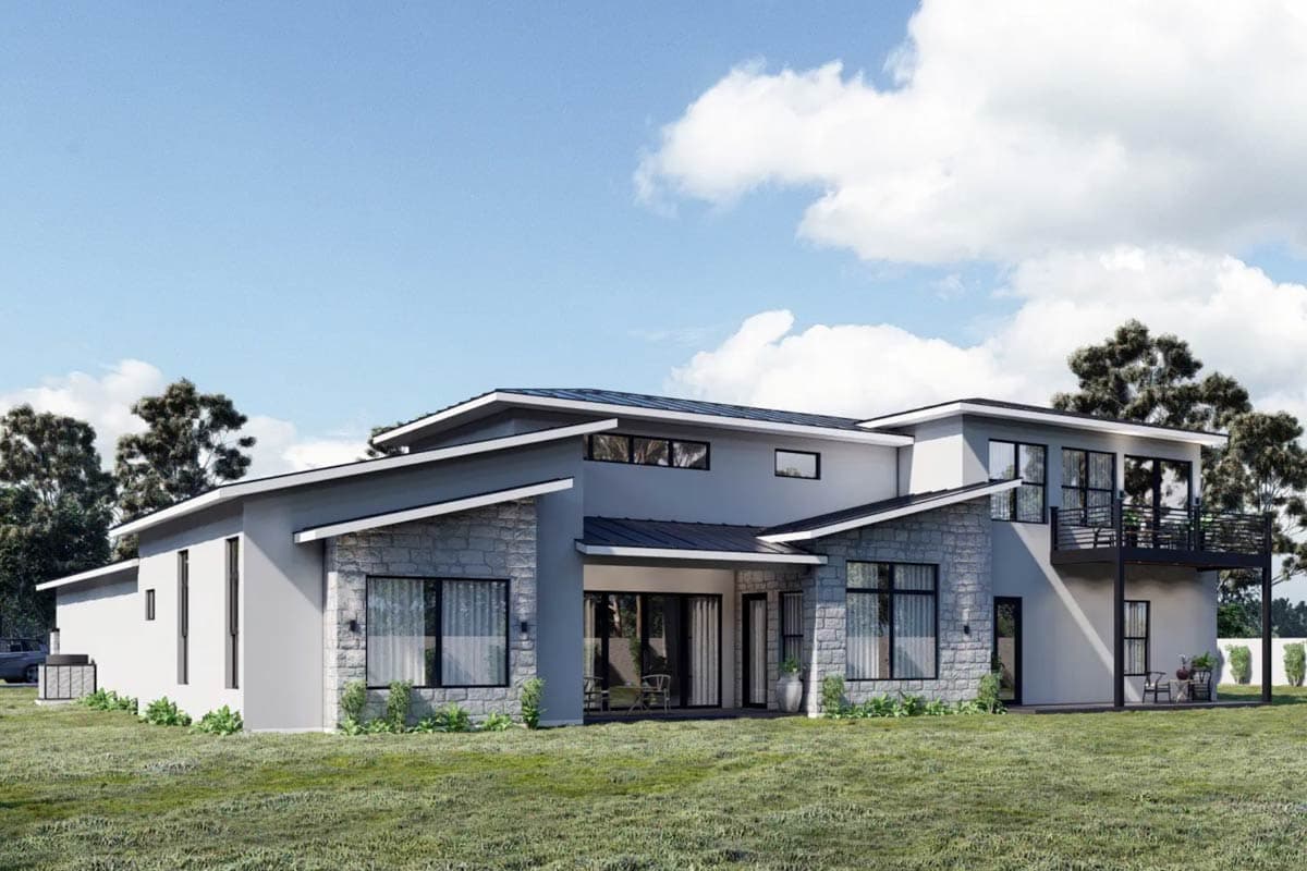 Modern house plan exterior with stone accents, multiple gables, and a second-story balcony.