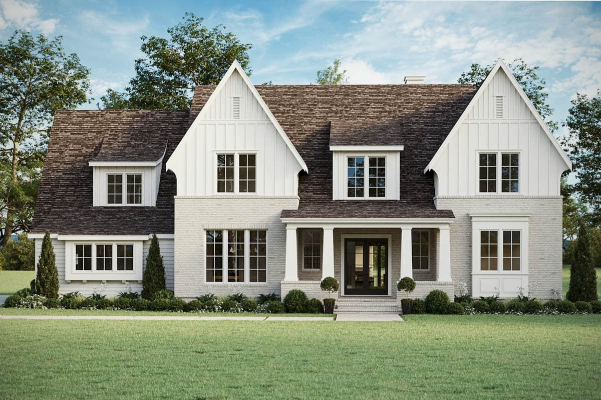 House plan exterior featuring a two-story design with a gabled roof, dormers, and a covered porch with columns.
