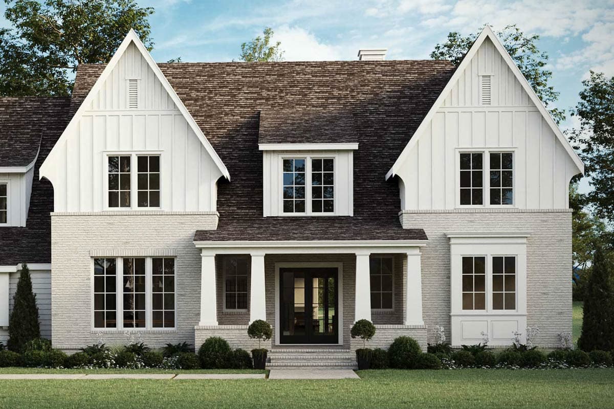 House plan exterior: Modern Farmhouse style, two stories, white vertical siding, brick facade, gabled dormers, and covered entry.