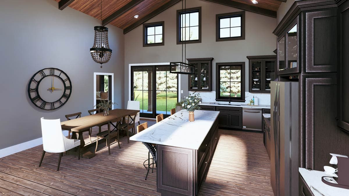 Open concept dining and kitchen area with vaulted wood-beamed ceiling, large island, dark cabinetry, and expansive windows.