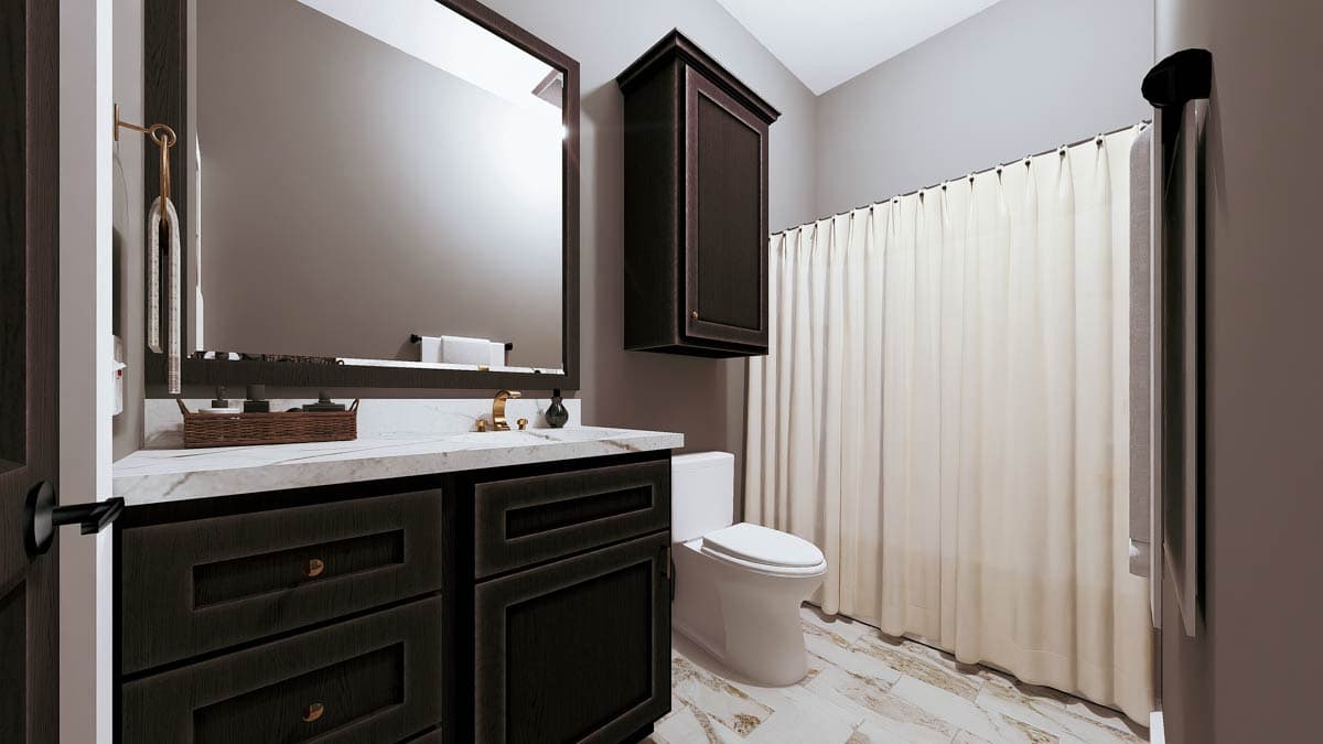 Bathroom with vanity, toilet, and shower with curtain. Dark wood cabinets, marble countertop, and tile floor.